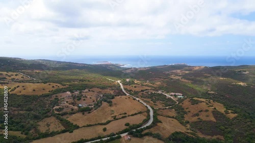 Fly over a busy highway, hills in the direction of the seaside