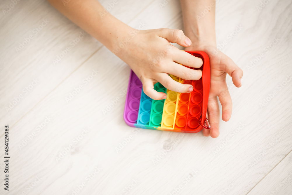 colorful toy pop it in the hands of a child colorful toy pop it in the hands of a child