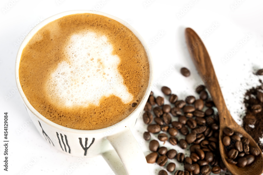 hot latte and coffee beans on white background hot latte and coffee beans on white background
