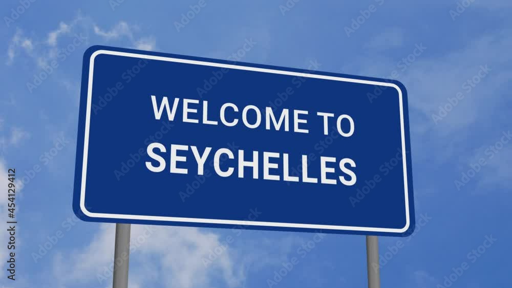 Welcome to Seychelles Road Sign on Clear Blue Sky with Rapid Moving Clouds Welcome to Seychelles Road Sign on Clear Blue Sky with Rapid Moving Clouds