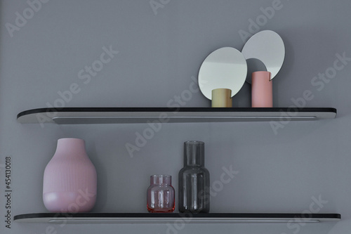 grey wall with decorated shelf