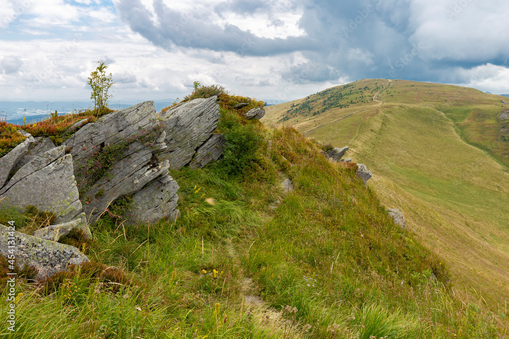 Verkhovyna Watershed Range, Pikui Mountain. Carpathian mountains with grassy slopes and rocks on Pikuy mount. Beautiful mountain landscape in summer Verkhovyna Watershed Range, Pikui Mountain. Carpathian mountains with grassy slopes and rocks on Pikuy mount. Beautiful mountain landscape in summer