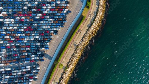 Parked cars viewed from above next to the sea in Bouzas, Vigo, Spain photo