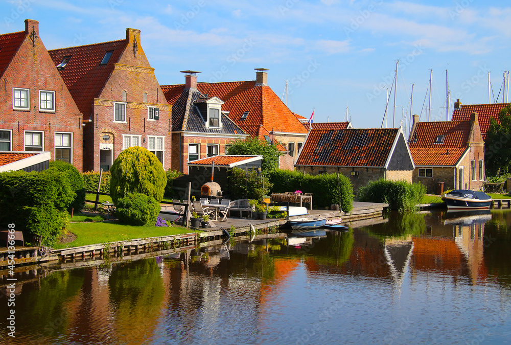 Gable architecture of typical Dutch residential homes along canal (Hindeloopen, Netherlands)