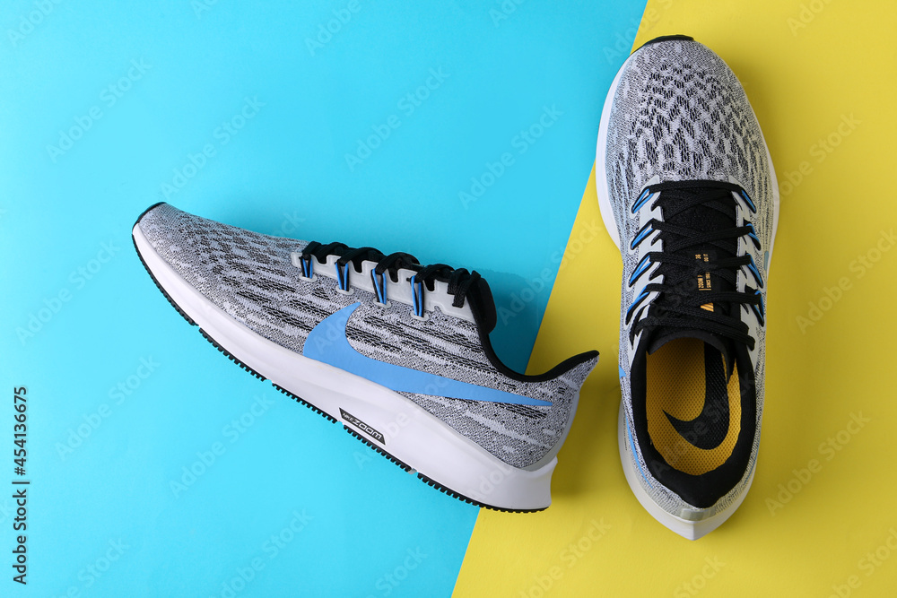 Jeddah Saudi Arabia August 30 2021: NIKE shoes on colorful background with  shadows - Image Stock Photo | Adobe Stock