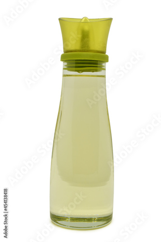 Glass oil bottle isolated on white background. Sunflower oil in glass jar