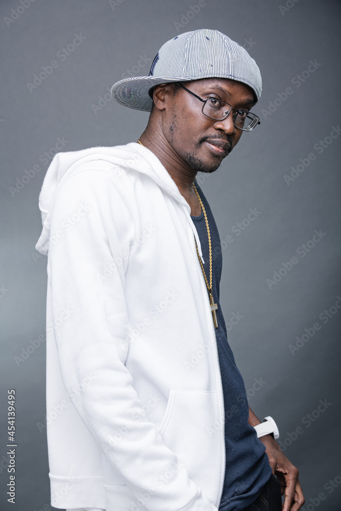 Young man offers a variety of poses and attitudes during a studio photo session Young man offers a variety of poses and attitudes during a studio photo session