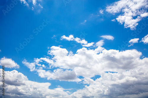 Fototapeta Naklejka Na Ścianę i Meble -  Fluffy cumulus clouds on blue sky background. Cloudscape white and grey color