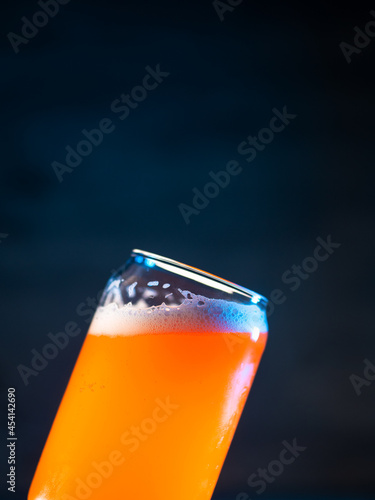 Платно A stylish glass of craft beer on a dark blue background