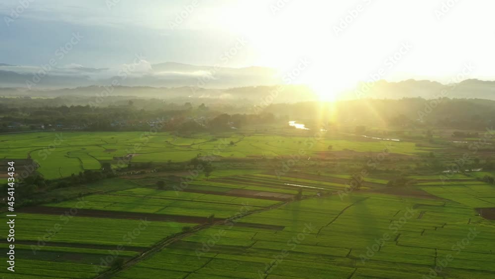 An aerial view of large agricultural areas, rice fields with streams running through it. Agricultural way of life in rural areas in northern Thailand, Nan province. An aerial view of large agricultural areas, rice fields with streams running through it. Agricultural way of life in rural areas in northern Thailand, Nan province.