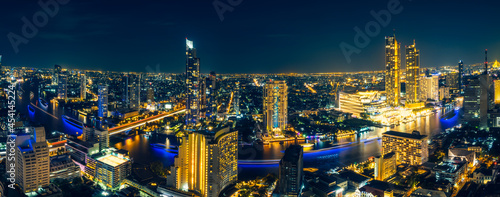 Night cityscape of famous downtown with Chao Phraya river in Bangkok Thailand