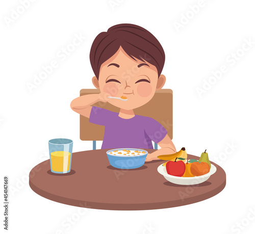 little boy eating breakfast