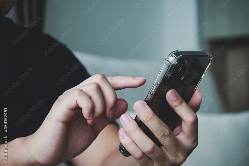 Fototapeta premium Close up of people holding and use smartphone, concept of social network playing, use technology.