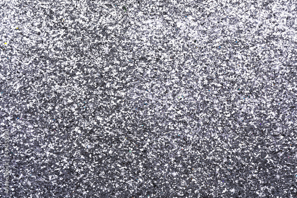 Beautiful shiny grey glitter as background, closeup