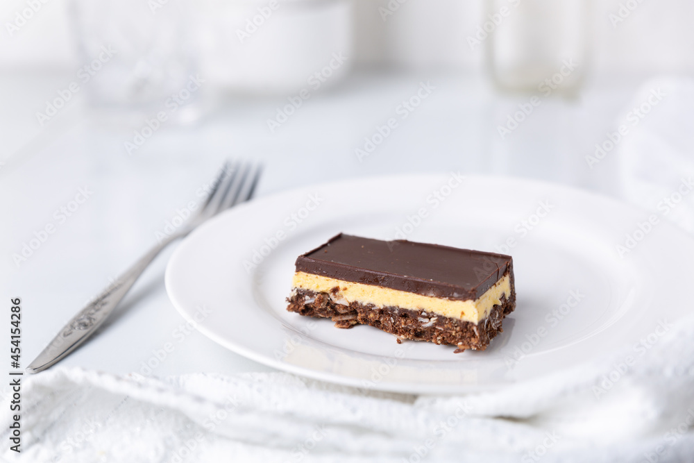 A plate with a Nanaimo bar - a traditional Canadian dessert A plate with a Nanaimo bar - a traditional Canadian dessert