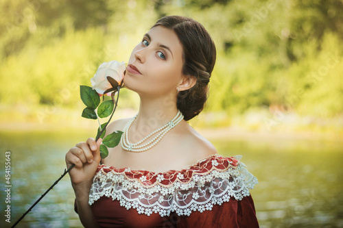 Fototapeta Portrait of a young woman in a historical dress from the 19th century