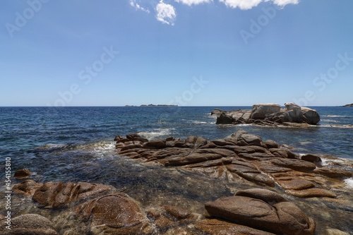 The island of Serpentara seen from the beach of Cala Pira, Sardinia, Italy photo