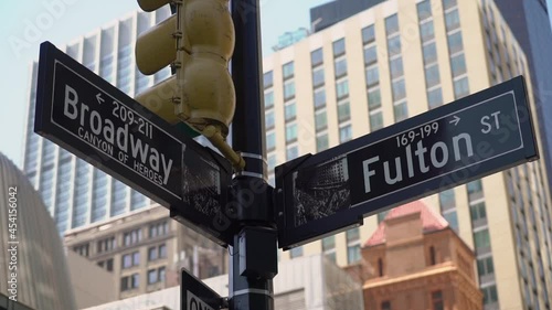 Road sign pointer to streets in New York. Corner of Fulton and Broadway streets. photo