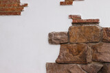 Wall texture. White wall with fragments of brickwork. The photo
