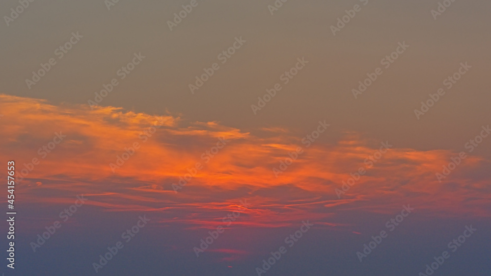 Warm orange sky after sunset over the north sea