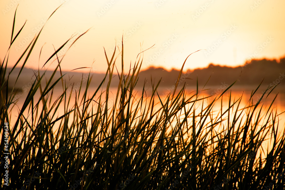 Sunset on lake bith blury background Sunset on lake bith blury background