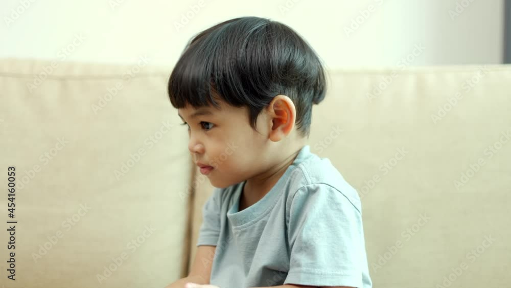 Asian little boy playing colorful ball in the living room. Sitting on sofa in the house. Developing children's learning before entering kindergarten Practice the skills.
Asian little boy playing colorful ball in the living room. Sitting on sofa in the house. Developing children's learning before entering kindergarten Practice the skills.