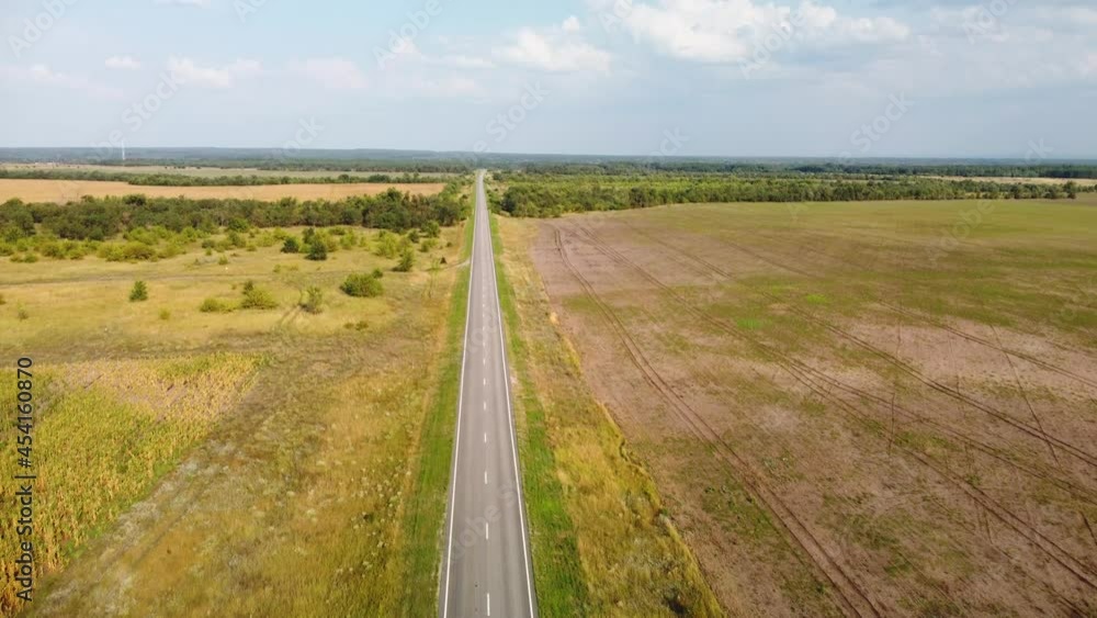 a highway stretching to the horizon among agricultural fields a highway stretching to the horizon among agricultural fields