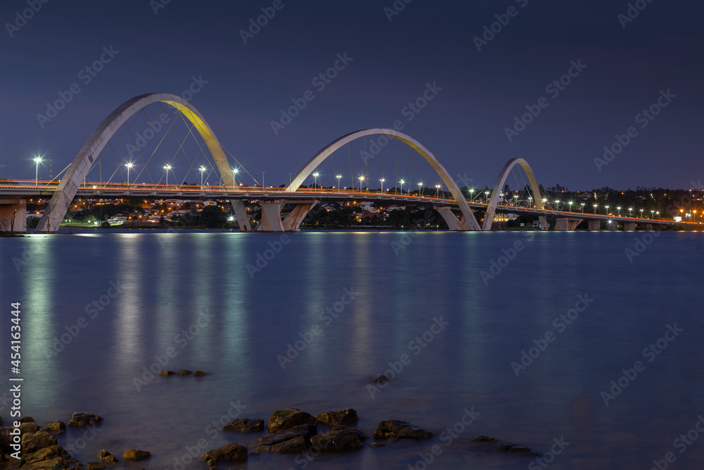 Naklejka premium When the night comes the lights appear to illuminate the city. Night view of JK bridge. Sky of Brasilia, capital of Brazil.