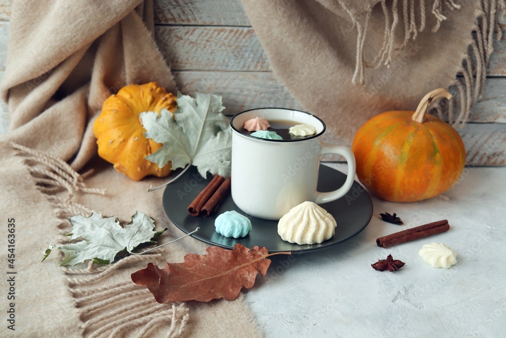 Cup of coffee, meringue, pumpkin, leaves, cashmere blanket, the concept of home comfort, relaxation, loneliness, Thanksgiving, autumn season Cup of coffee, meringue, pumpkin, leaves, cashmere blanket, the concept of home comfort, relaxation, loneliness, Thanksgiving, autumn season
