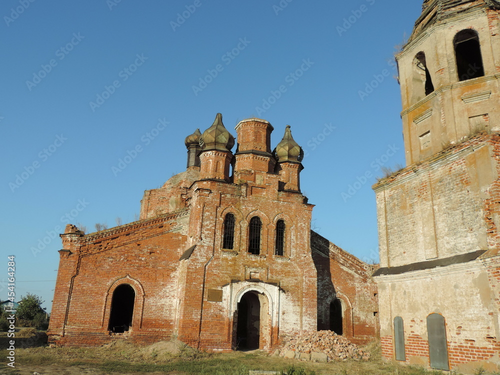 An abandoned church and a red brick bell tower in the deep province.