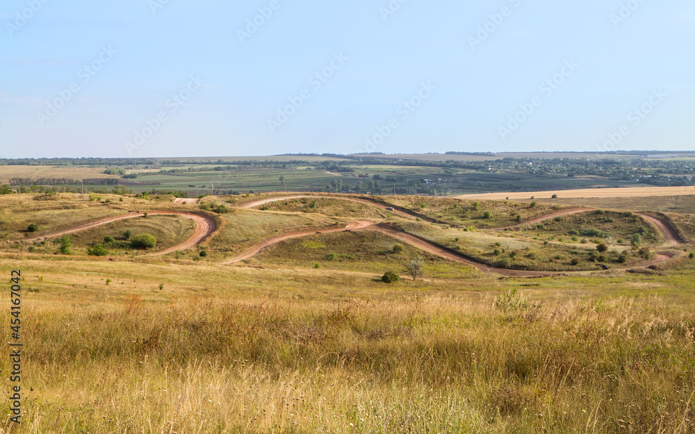 Autumn steppe with a track for autocross.