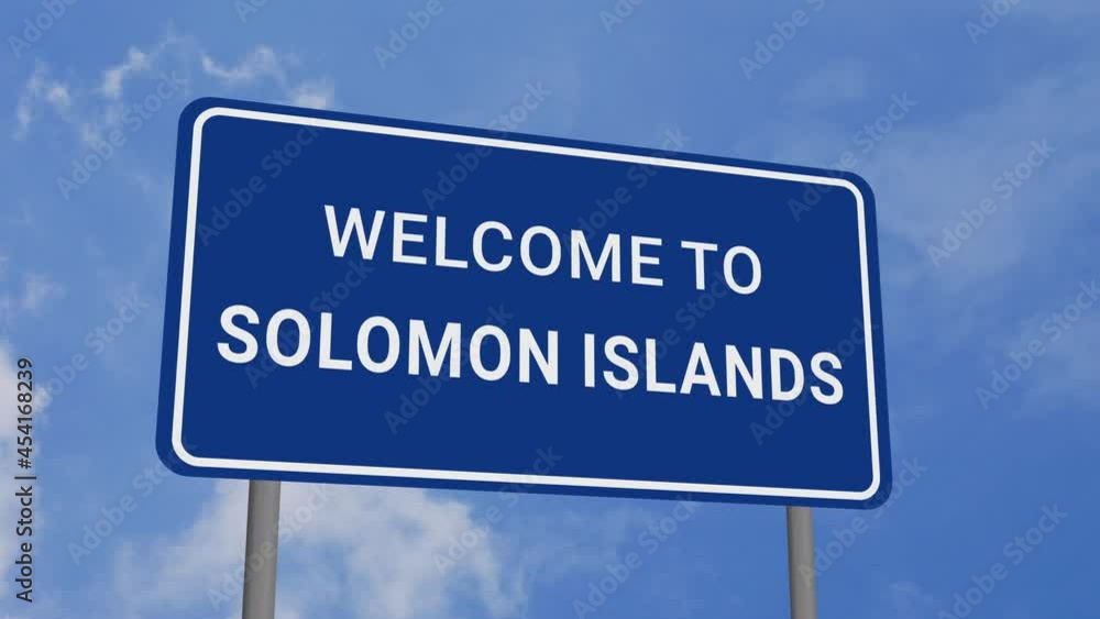 Welcome to Solomon Islands Road Sign on Clear Blue Sky with Rapid Moving Clouds Welcome to Solomon Islands Road Sign on Clear Blue Sky with Rapid Moving Clouds
