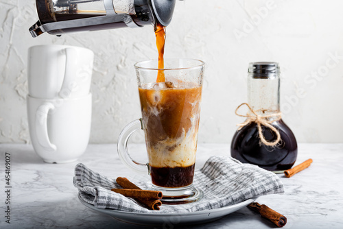 Iced Latte Pouring Coffee over Milk Cold Drink
 photo