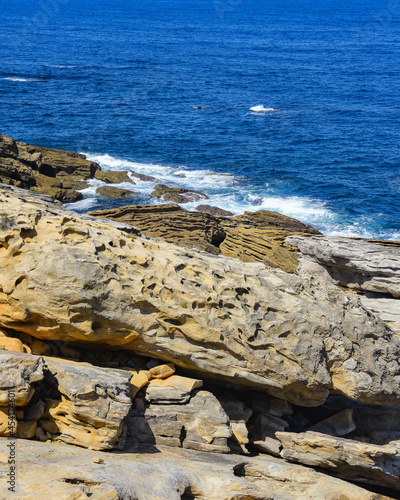 Colourful sandstone rock formations on the Cantabrian coastline. Mount Jaizkibel, Basque Country, Spain photo