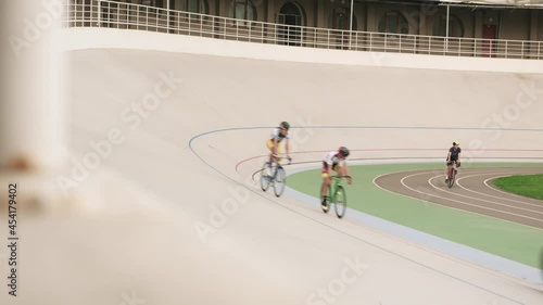 Pursuit bicycle race on cycling track. Track cycling team training on velodrome photo