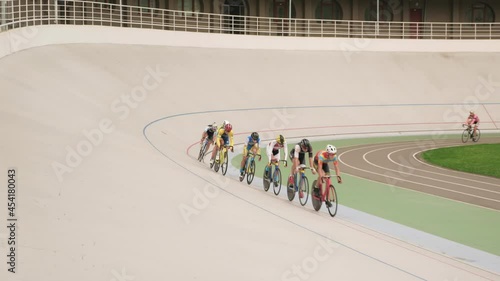 Bicycle race velodrome competition. Cyclists training on cycling track. Pursuit bike race on track photo