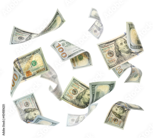 Many American dollars on white background. Flying money
