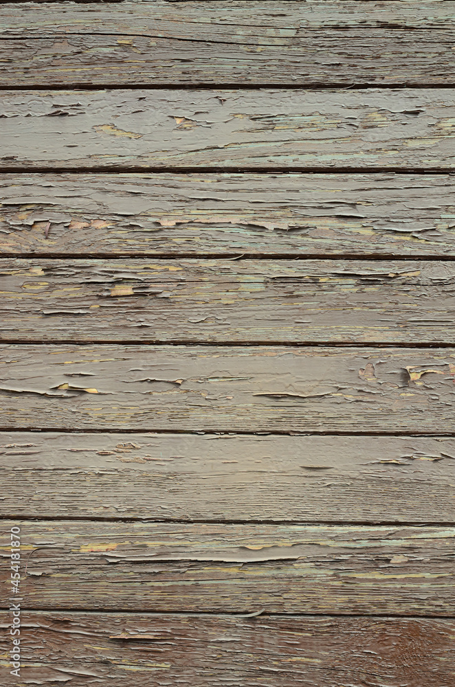 Textured wall made of wooden boards with peeling paint background Textured wall made of wooden boards with peeling paint background