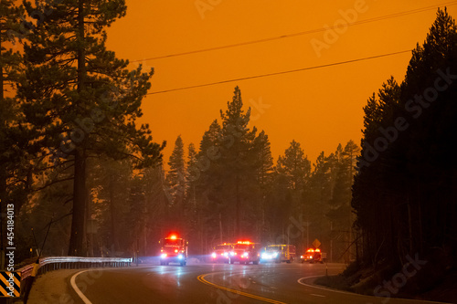 Firefighters battleing fire as Flames approaching Highway 50 during Caldor Fire in California photo