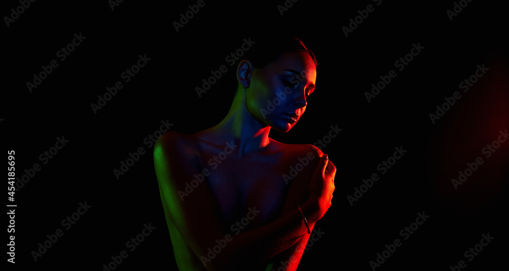 Female silhouette, beautiful woman in color lights Female silhouette, beautiful woman in color lights