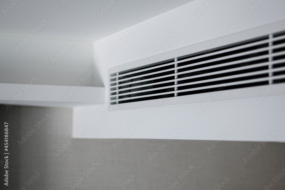 Air ventilator, metal slat frame on white ceiling. Air ventilator, metal slat frame on white ceiling.