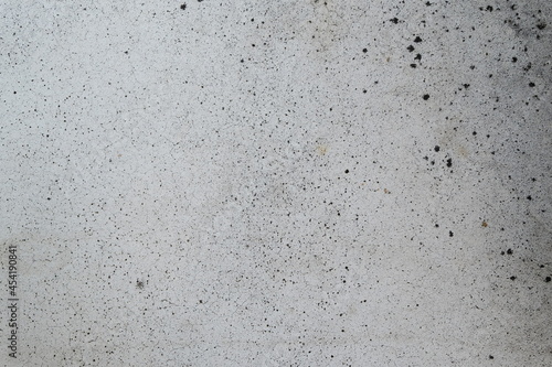 texture of white stone with black splashes close up 