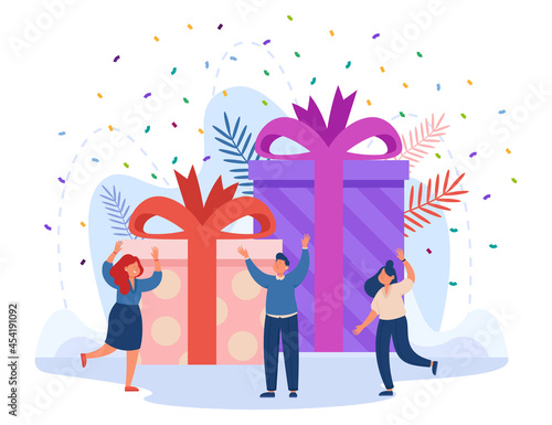 Confetti falling on happy winner in front of giant gift boxes. Loyalty bonus or special reward for good job, birthday present flat vector illustration. Celebration concept for banner, website design