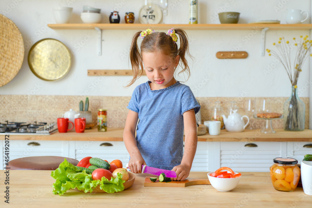 portrait of a little cute girl in the kitchen with groceries and healthy food portrait of a little cute girl in the kitchen with groceries and healthy food