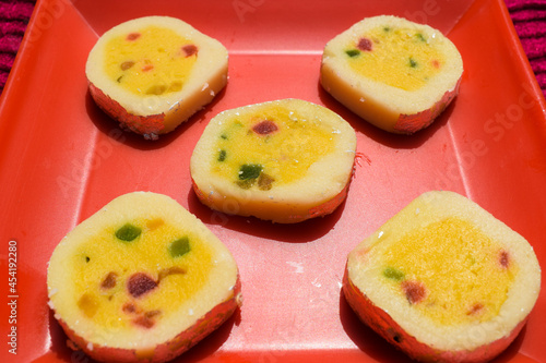 Indian sweet dish Tutti fruity Barfi rolls. With tutti frutti kesar flavour. Basically made of milk solids called khoya this is very tasty sweet dish served during festivals