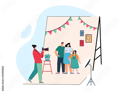 Cartoon photographer taking pictures of parents and kid. Flat vector illustration. Happy mother, father and daughter posing in front of camera in photo studio. Photography, family, shooting concept