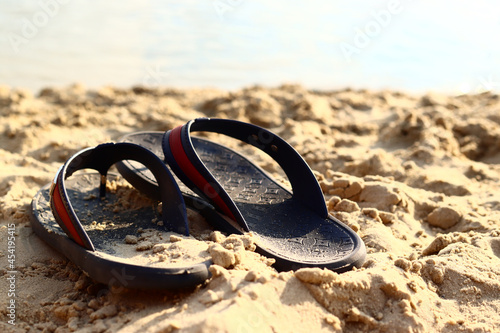 Flip flops on a sandy beach. Summer vacation concept