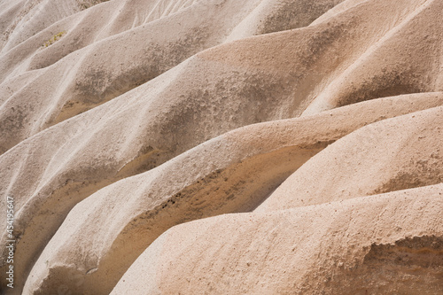 Rocks as a background. Smooth lines of rocks as a design image. Natural abstraction.