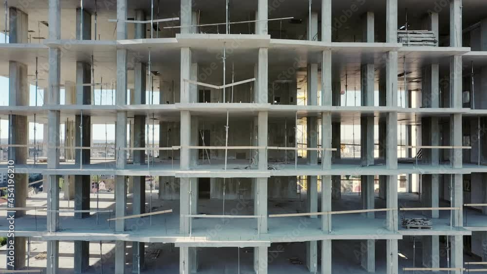 Aerial view of high residential apartment building under construction. Real estate development Aerial view of high residential apartment building under construction. Real estate development