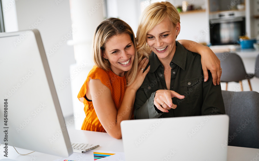 Startup business partners women working together in office Startup business partners women working together in office